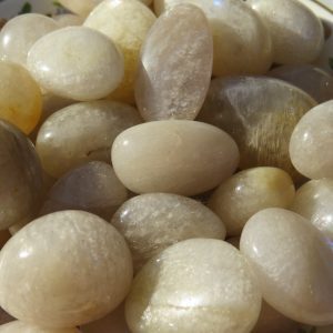 Bowl of smooth white gemstone pebbles.