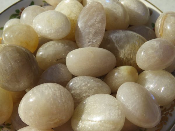 Bowl of smooth white gemstone pebbles.