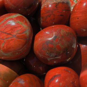 Red jasper stones with veins and shine.