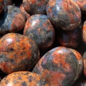 Closeup of polished, red and grey stones.