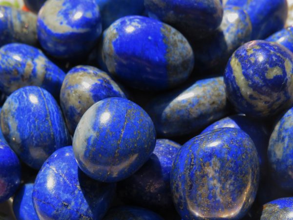 Closeup of blue and white lapis lazuli stones.
