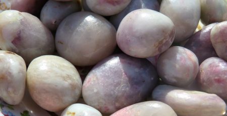 A pile of smooth, white and pink rocks.