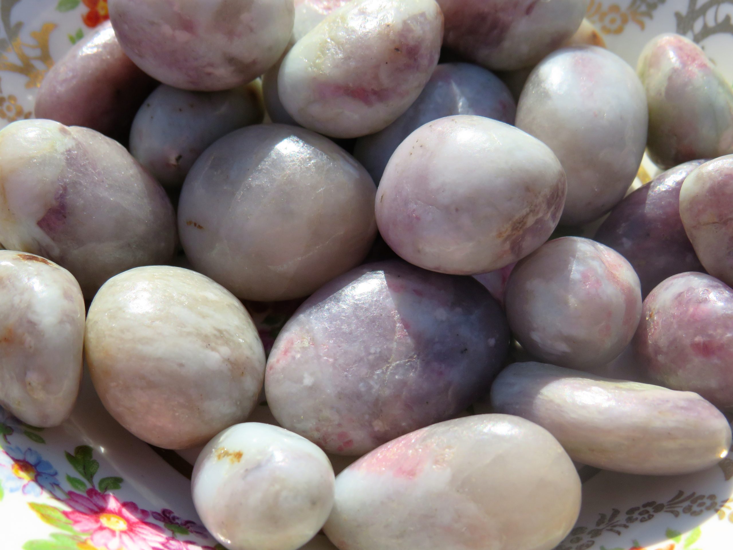 A pile of smooth, white and pink rocks.