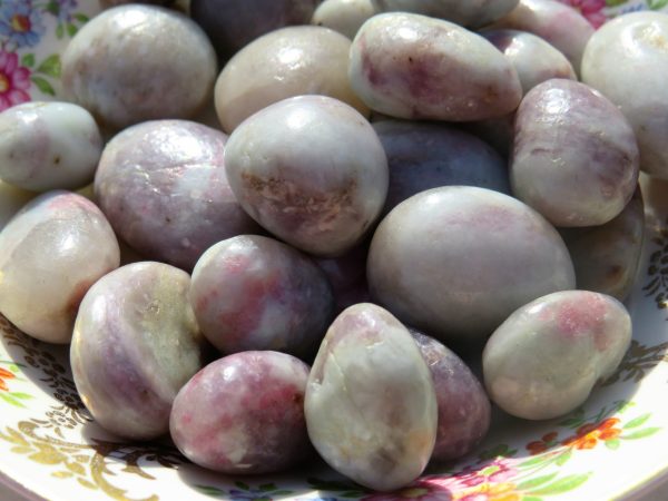 Smooth, pearly, lavender gemstone pebbles.