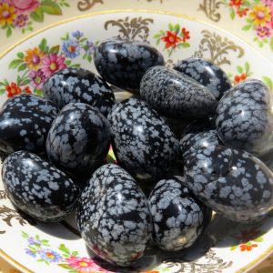 Polished black and white snowflake obsidian stones.