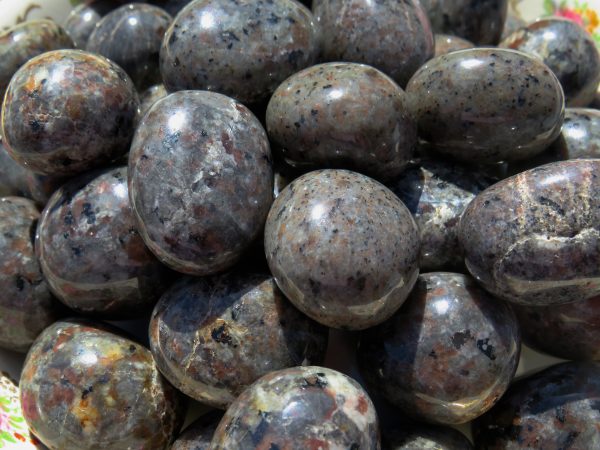 Closeup of smooth, gray, speckled stones.