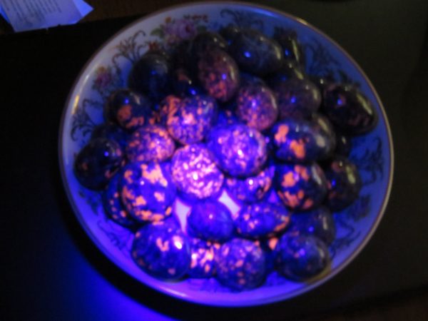 Blue and orange stones on a plate.