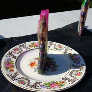 Iridescent crystal on floral plate.