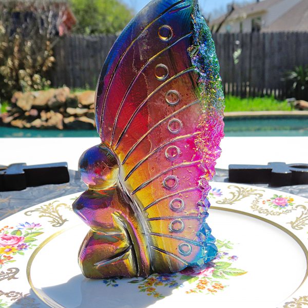 Rainbow iridescent glass butterfly figurine.