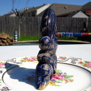 Blue and white stone sculpture on a plate.