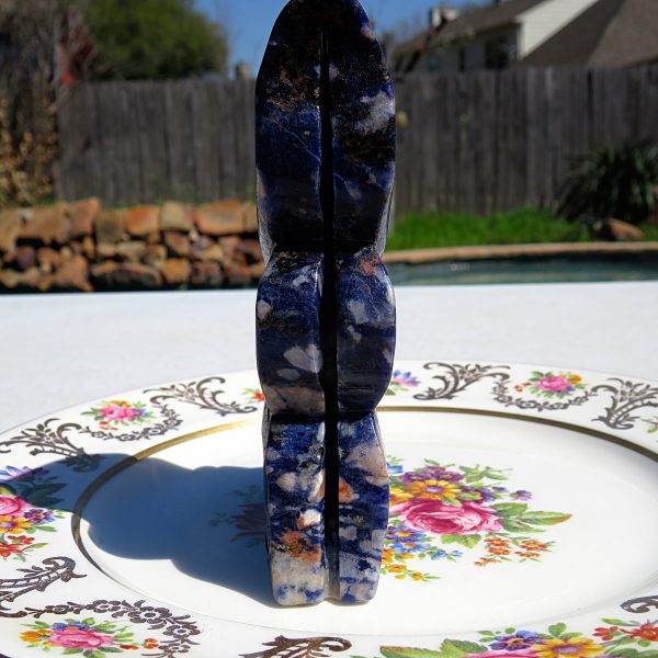 Blue and white gemstone on a plate.