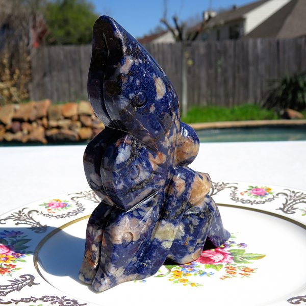 Blue and white carved stone butterfly figurine.