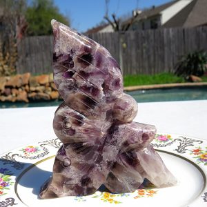 A purple amethyst butterfly figurine.