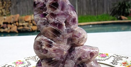 A purple amethyst butterfly figurine.