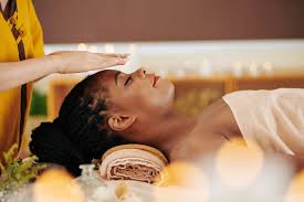 A woman getting a massage at a spa in image in color