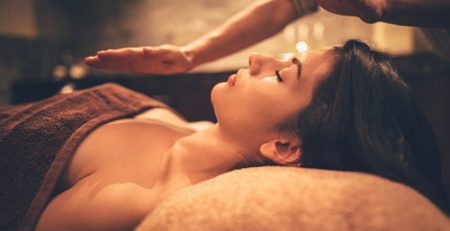 A woman getting a massage at a spa in brown image in color