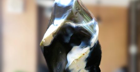 A piece of agate sitting on a table in a living room.