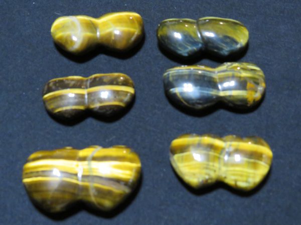 Five pairs of tiger's eye stones.