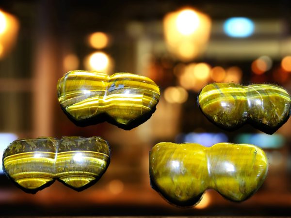 Four yellow tiger's eye heart stones.