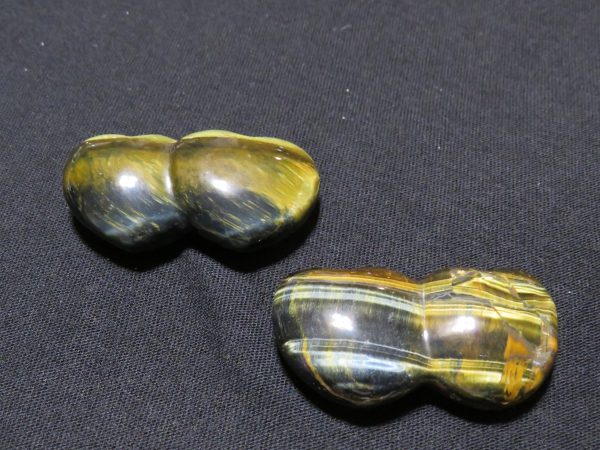 Two polished tiger's eye stones.