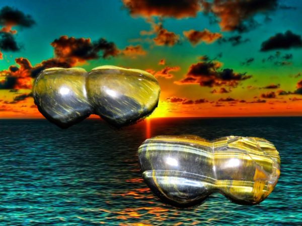 Two tiger's eye stones in water.