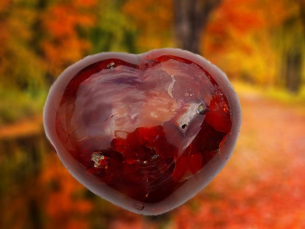 Red heart-shaped carnelian gemstone.