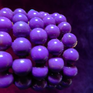 Purple spheres clustered on a dark background.