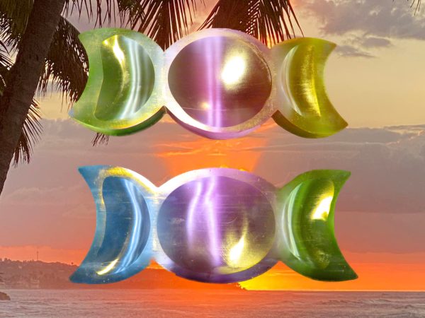 A group of Rainbow Aura Selenite Three Moon Bowl Charging
